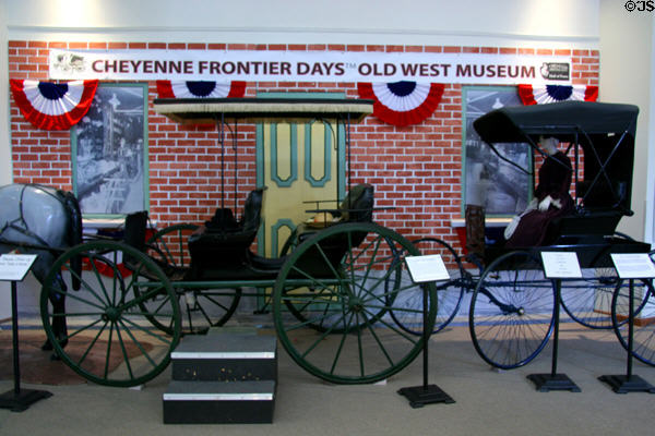Canopy top surrey (c1885) & wire-wheeled top buggy (c1900) by Buckeye Buggy Co., Columbus, OH, at Cheyenne Frontier Days Old West Museum. Cheyenne, WY.