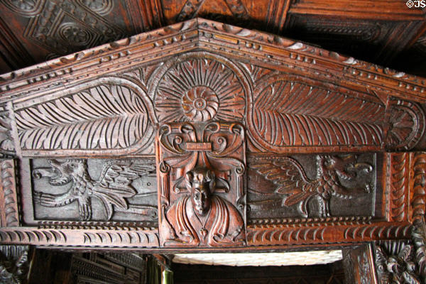 Decorative carved wood panel set over a doorway at Plas Newydd. Llangollen, Wales.
