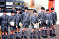 Uniformed school boys line up on a street. Sydney, Australia.