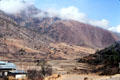 Farmland at foot of mountains surrounding between Paro & Thimpu. Bhutan.