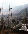 View of Thimpu from stupa & prayer flags near area's radio tower. Bhutan.