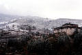 Simtakha Dzong in snow on way to Dochu La Pass. Bhutan.