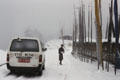 Van driving in snow at Dochu La Pass. Bhutan.
