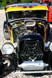Spider-themed pickup hotrod at car rally. NB.