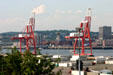 Container port cranes loom over Saint John harbor. Saint John, NB.