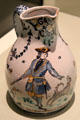 Earthenware jug with portrait of M. Tourer with hunting gun & dog made by Moulins of France at Gardiner Museum. Toronto, ON.