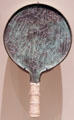Etruscan bronze mirror back depicting pair of Lasa goddesses of fate each holding an alabastron at Royal Ontario Museum. Toronto, ON.