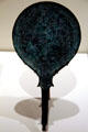 Italic bronze mirror back depicting two military figure in combat at Royal Ontario Museum. Toronto, ON.