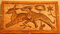 Floor mosaic with hound chasing hare from Eastern Mediterranean at Royal Ontario Museum. Toronto, ON.