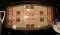 Earthenware tray in stenciled slip pattern by Villeroy & Boch of Mettlach, Germany at Royal Ontario Museum. Toronto, ON.