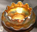 Iridescent gold Favrile glass fingerbowl by Louis Comfort Tiffany of New York City at Royal Ontario Museum. Toronto, ON.