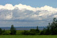 Confederation Bridge to PEI seen across farm fields. PE.