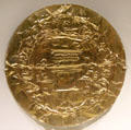 Gold disk with masks in relief from Central America at Montreal Museum of Fine Arts. Montreal, QC