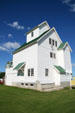 Seed cleaning elevator typical of prairie agricultural architecture at Doc's Town. Swift Current, SK