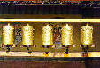 Golden prayer wheels in Drepung Monastery, Tibet. China.
