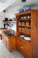 Cupboard built to prevent dinner plates sliding out in rough seas on Rickmer Rickmers museum sailing ship. Hamburg, Germany.