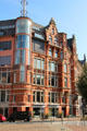 Heritage building with modern corner tower beside St Catherine's Church. Hamburg, Germany.