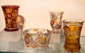 Glass beakers with engravings into colored layers at Hamburg History Museum. Hamburg, Germany.