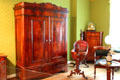 Typical sitting room in Hamburg with walnut furniture in a mixture of styles at Hamburg History Museum. Hamburg, Germany.