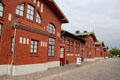 Row of buildings including dormitories, living areas, dining rooms, church, synagogue, a music venue and a medical center at Emigration Museum BallinStadt. Hamburg, Germany