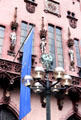 Ornamental street lighting in front of statues of three of four Holy Roman Emperors on Haus zum Römer. Frankfurt am Main, Germany.