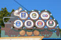 Beer wagon with Munich brewery brands on pole of German Beer Purity Law at Viktualienmarkt. Munich, Germany.
