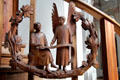 Modern pulpit carving of Evangelist St Matthew with angel symbol at Heilig-Geist-Kirche. Munich, Germany.