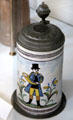 Faience & metal bier krug with hunting horn player from Ansbach, Germany at German Hunting & Fishing Museum. Munich, Germany.