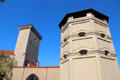 One of two Octagonal towers plus taller clock tower of Isartor city gate. Munich, Germany.