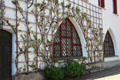 Espalier over Gothic arch at Munich City Museum. Munich, Germany.