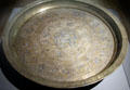 Muslim brass-silver serving platter from Iraq at Five Continents Museum. Munich, Germany.