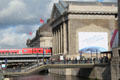 Train crosses Museum Island beyond Pergamon Museum. Berlin, Germany.