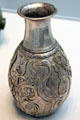 Partially gilded silver vase with cranes between palm fronds from Iran at Pergamon Museum. Berlin, Germany.