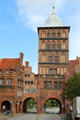 Burgtor with Baroque cap-like roof which replaced original & widened arched passage from 1850 & 1928. Lübeck, Germany.