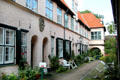 Mini gardens of apartments at Füchtings Courtyard. Lübeck, Germany.