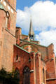 Flamboyant central spire & brick flying buttresses of St Mary's Church. Lübeck, Germany.