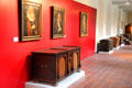 Historic portraits over Germanic chests at Cultural History Museum. Rostock, Germany.