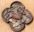 Winged bull of evangelist Luke in quatrefoil linden wood carving at Schleswig Holstein State Museum. Schleswig, Germany.