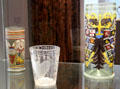 Glass mug with enameled bride & groom , beaker engraved with coat of arms c1680 & imperial eagle humpen at Schleswig Holstein State Museum. Schleswig, Germany.