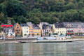St Goar with a Rhine River barge passing by. St. Goar, Germany.