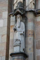 Religious statue on Liebfrauenkirche facade. Trier, Germany.