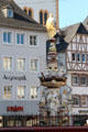 St Peter's Fountain & Germanic residence facades in Hauptmarkt. Trier, Germany.