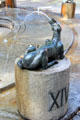 Dog marking the hour in Water Clock Fountain beside Red Tower. Trier, Germany.