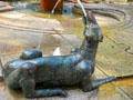 Dog marking the hour in Water Clock Fountain beside Red Tower. Trier, Germany.