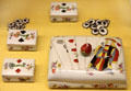 Meissen porcelain lidded box & subboxes with game chips painted to mimic playing cards at Meissen porcelain museum at Lustheim Palace. Munich, Germany.