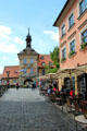 Bridge approach to Bamberg Old Town Hall from east showing clock tower over open passage through tower. Bamberg, Germany.
