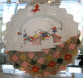 Meissen porcelain plate with painted checkerboard pattern & flying squirrels at Bamberg Old Town Hall Museum of Faience & Porcelain. Bamberg, Germany.
