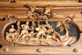 Using dogs to hunt bear scene carving in Intarsia Hunting Room at Coburg Castle. Coburg, Germany.