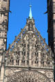 Central spire & Gothic carvings on facade of St Lawrence Church. Nuremberg, Germany.