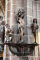 Carved holy figures on column in St Lawrence Church. Nuremberg, Germany.